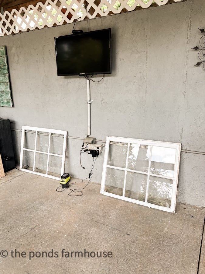 Reclaimed windows for DIY outdoor kitchen cabinets.