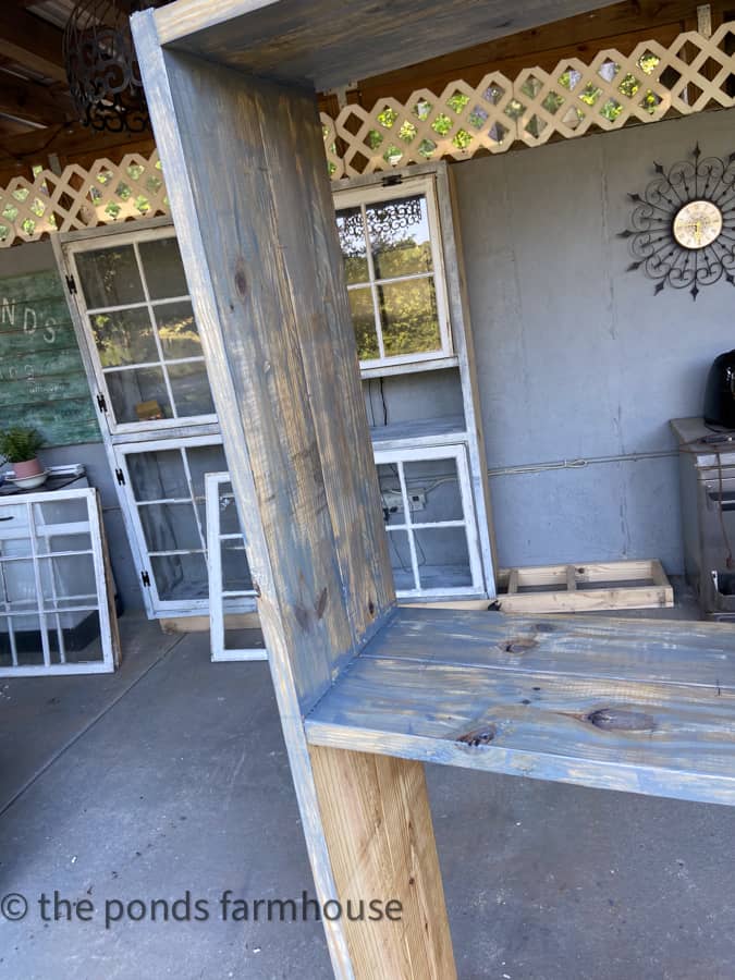 DIY outdoor kitchen being painted with base coat.