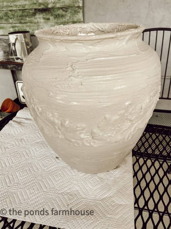 Vessel for faux earthenware hack coated in spackle and paint.