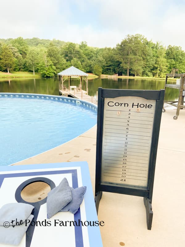 DIY corn hole scoreboard by the pool