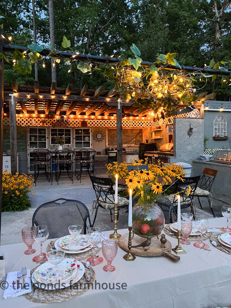 DIY Over the table stand with twinkle lights and deconstructed lamp shades  on summer tablescape