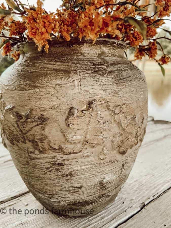 Completed earthenware vessel dupe with flowers.