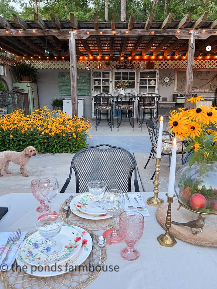 Peachy Keen outdoor dinner party for summer entertaining.  Alfresco table setting at outdoor kitchen