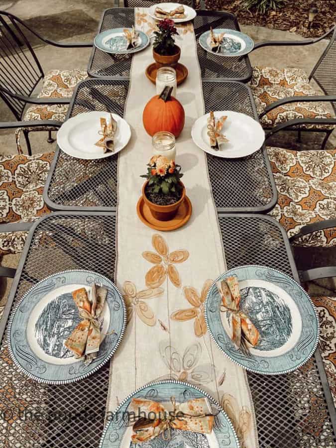 Mix and Match Thrift Store Dishes on outdoor table.