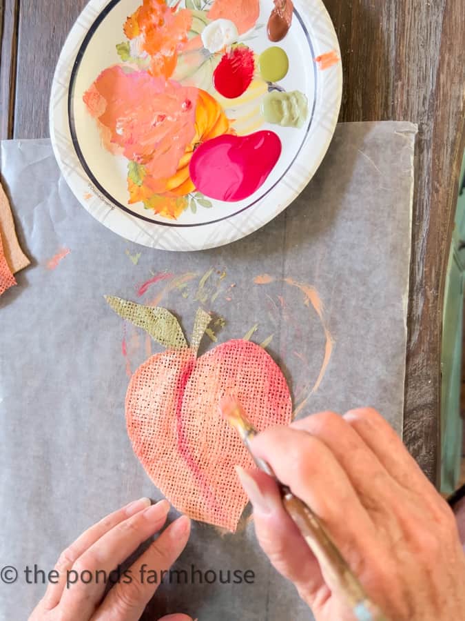 DIY Burlap Coasters are painted with craft paints and a small brush.  