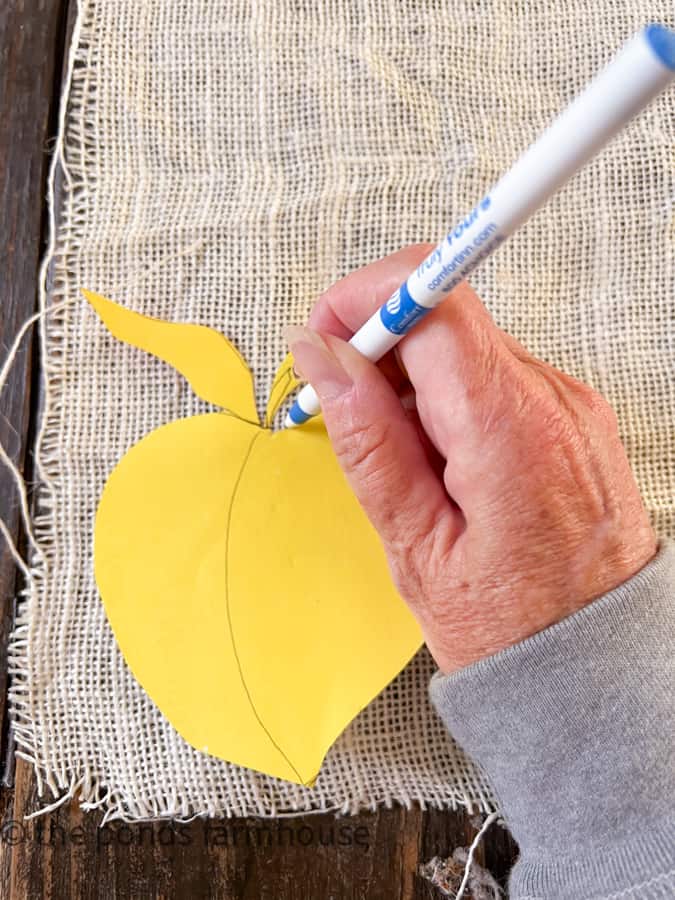 Trace the shape of your coaster on the stiff burlap fabric.  Use a template to match all the coasters