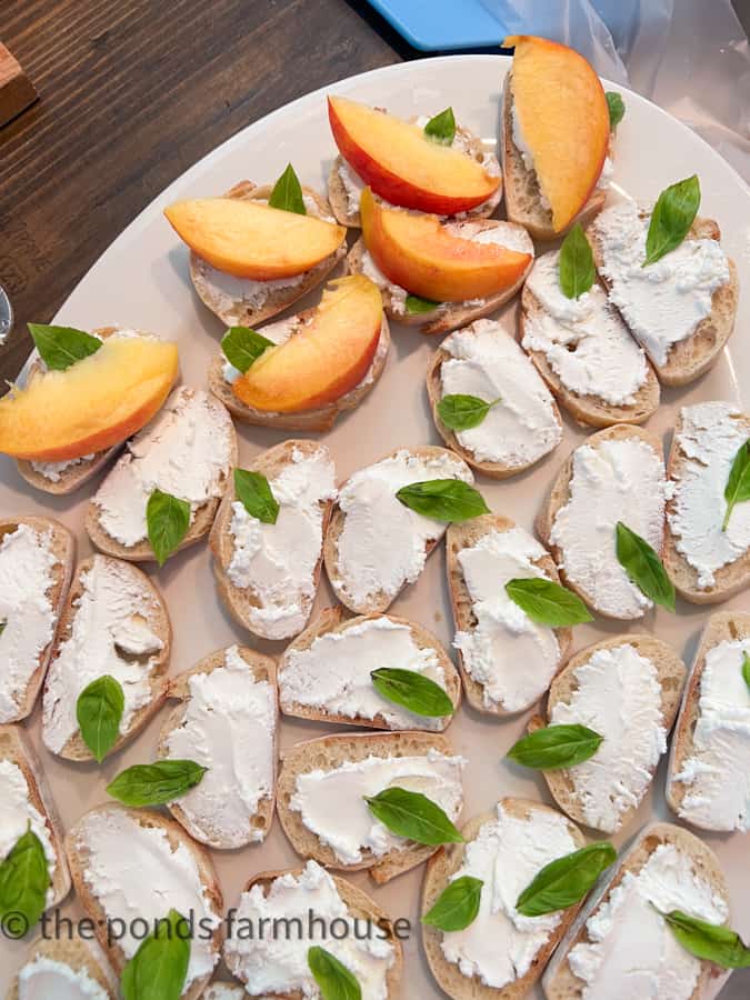 Add basil leaves to the goat cheese before adding the peaches with balsamic glaze.
