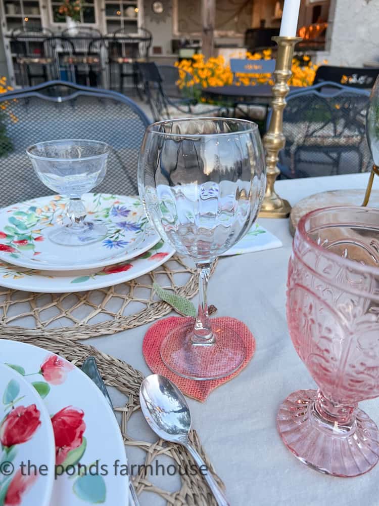 Thrift Store wine glass on DIY Peach Burlap Coaster for Everything Peachy Keen Tablescape.
