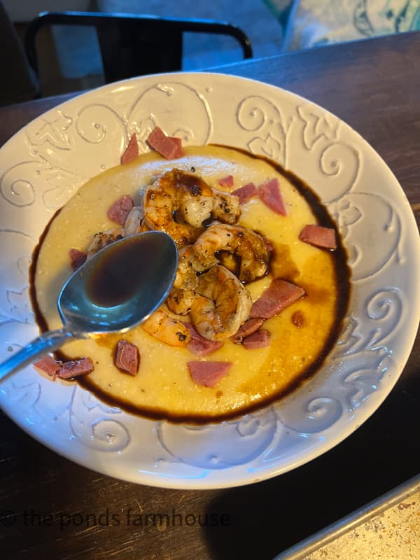 The secret to the shrimp and grits best recipe is the drizzle of red eye gravy