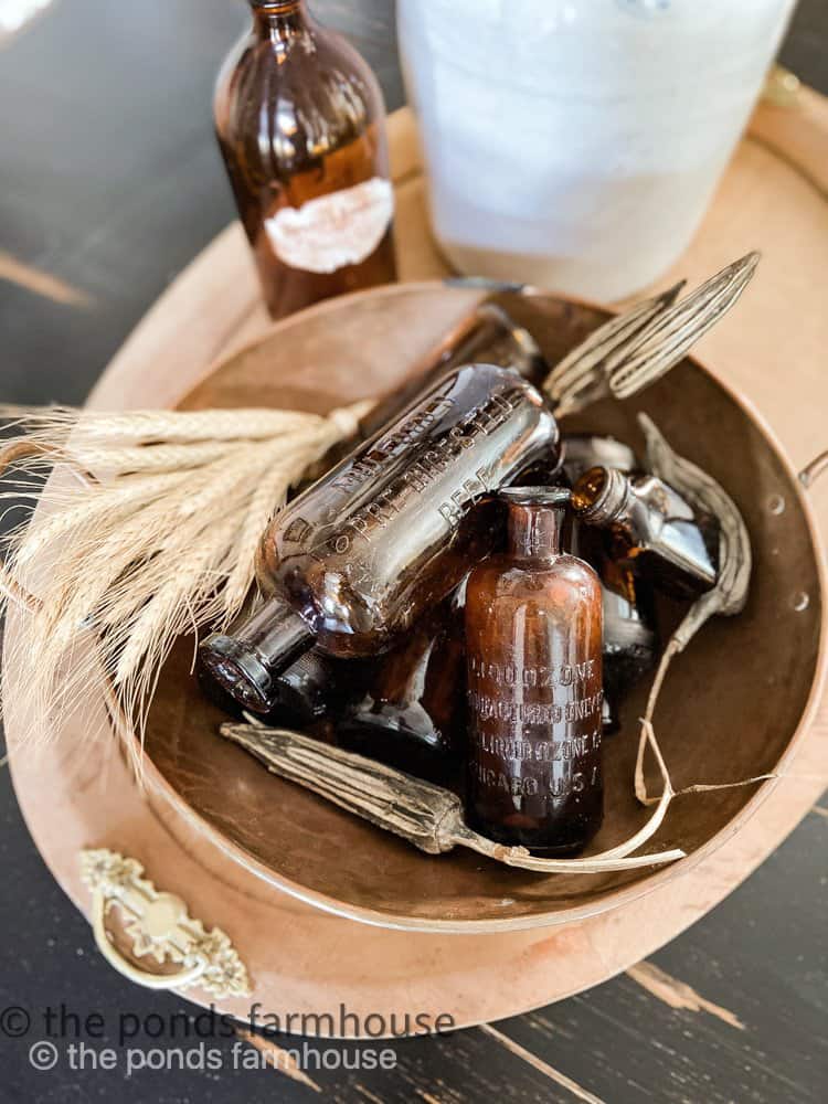 Vintage Amber Glass Bottles for fall decorating. Rustic Autumn Decor for Farmhouse Style Decorating.