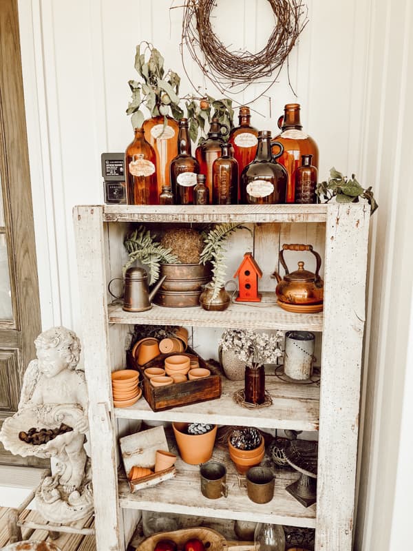 Rustic Fall Decorating with Antiques and Vintage colored glass Bottles