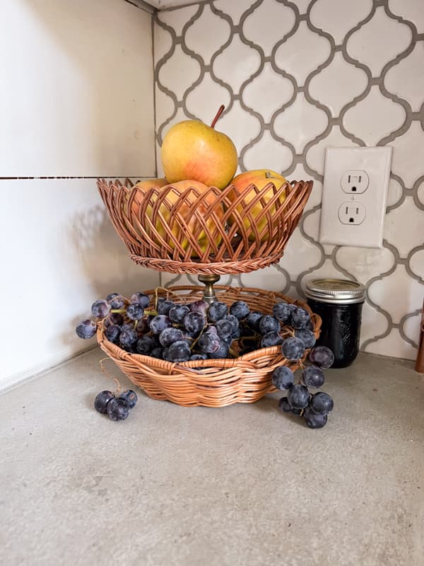 Pottery Barn Hack - DIY Basket Tray with fruit on farmhouse kitchen countertops.