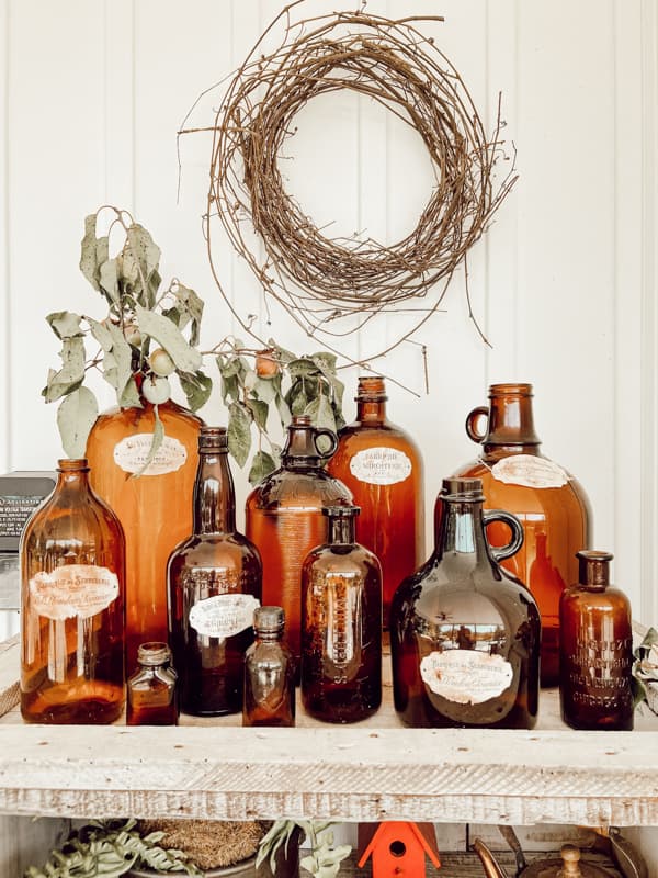 Amber Glass Bottles for Rustic Fall Decorating Ideas.  Farmhouse, cottage and country style home decor. 