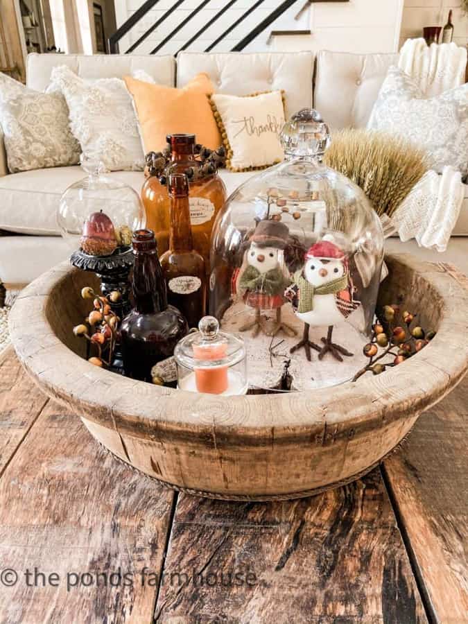 Antique Fall Decor - Colored Glass Bottles with Glass Cloches in a wooden bowl for coffee table centerpiece