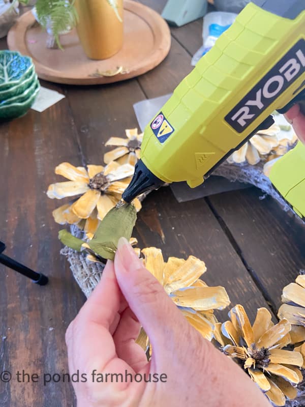 Use hot glue to attach the leaf petals.