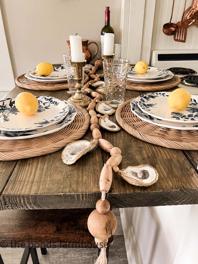 Oyster shell garland as table runner for coastal table setting