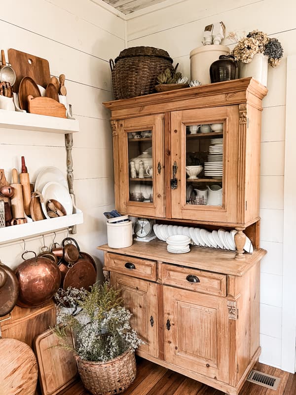 Honey Pine hutch with ironstone and vintage copper on wall plate rack in Farmhouse Kitchen