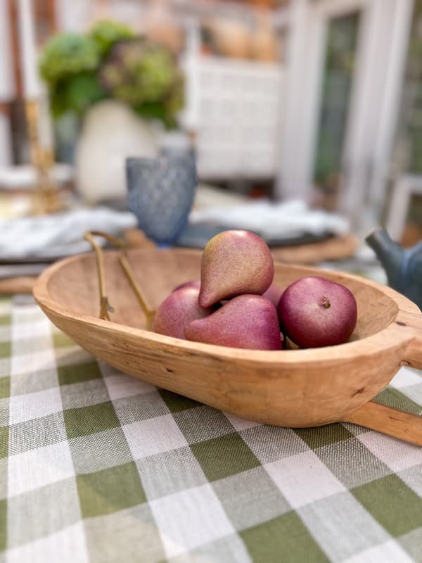 faux figs in handcrafted wooden dough bowl for cheap potluck ideas.  