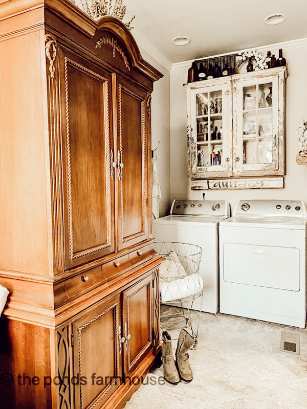 Decorate laundry room cabinet with antique bottles 