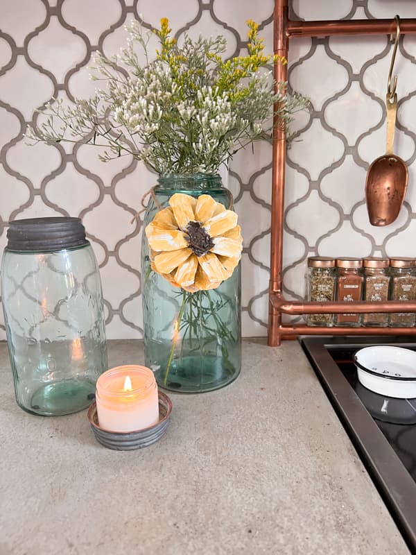 Vintage blue canning jars with wild flowers and a pinecone DIY  sunflower