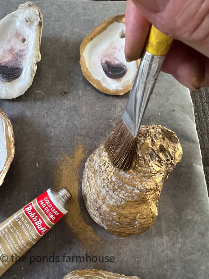 Brush RubNBuff gold leaf to the oyster shell craft.