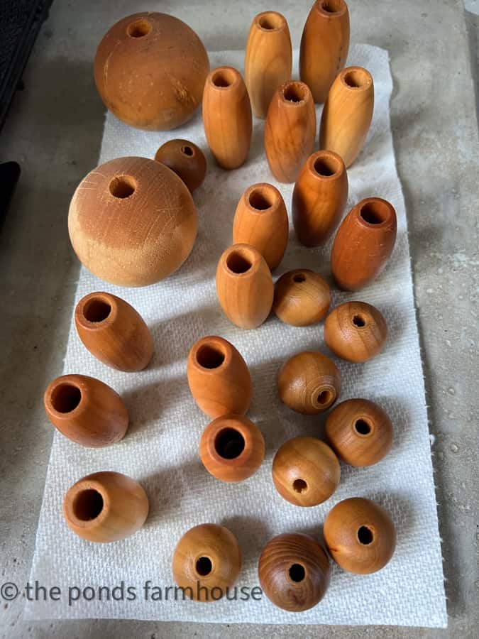 soak wooden beads in coffee to stain them to look like old fishing corks.