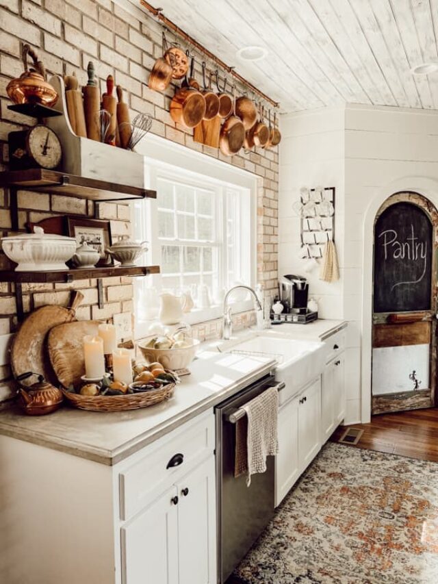 Industrial Farmhouse Kitchen with brick wall and DIY Pantry Door. Copper and vintage finds for a cozy country kitchen.
