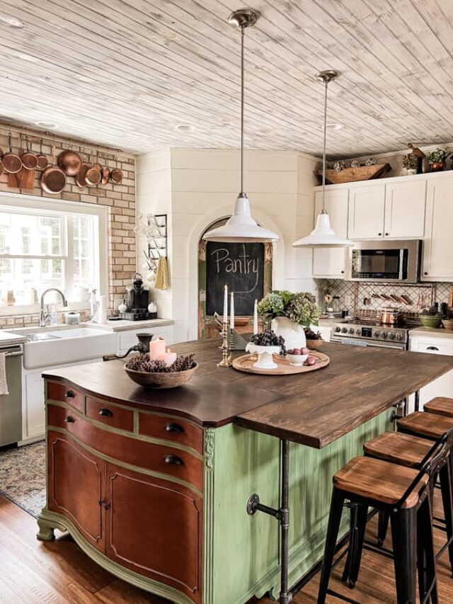 DIY Kitchen Island with natural wood top and green paint in farmhouse kitchen with pantry door.