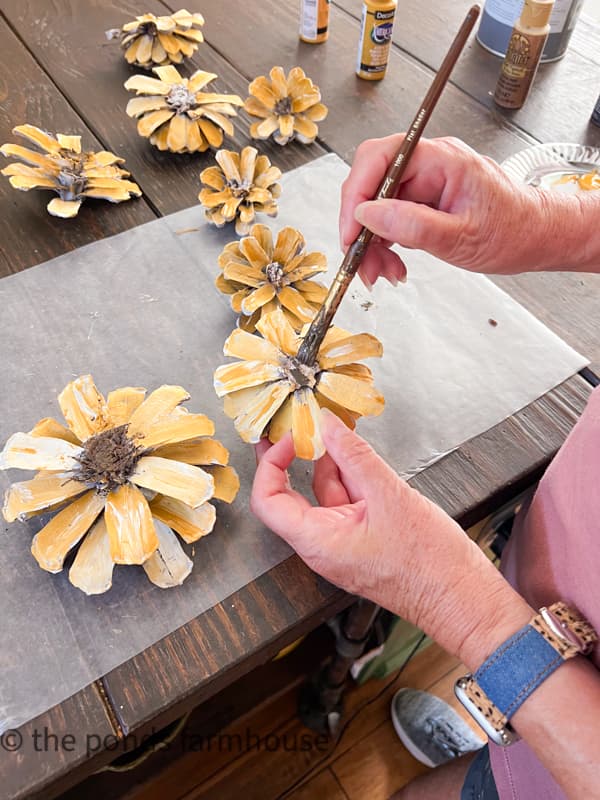 Add raw umber craft paint to create the centers of the sunflowers