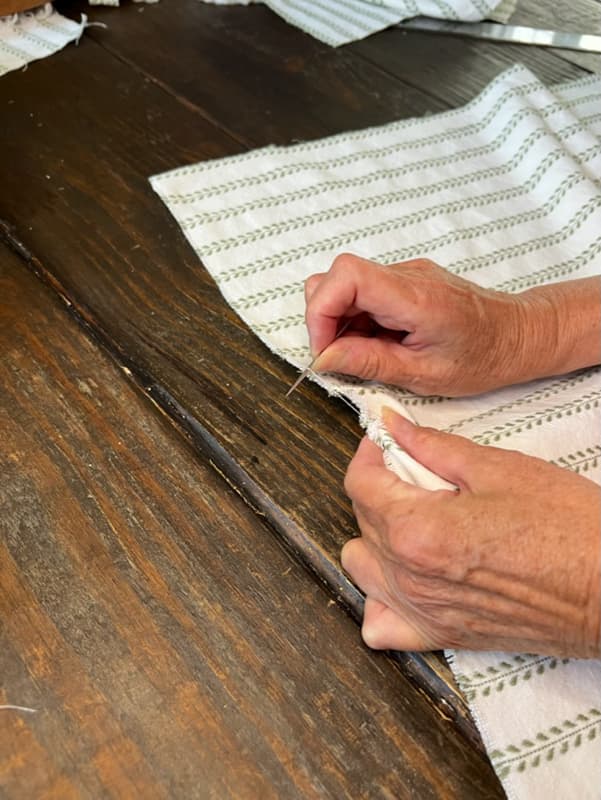 pull threads to follow grain of fabric for square napkins