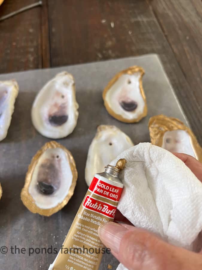 Add gold leaf to rim of oyster shell craft to add a little glam.  