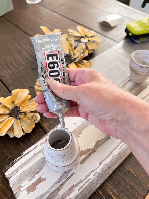 Add E6000 Glue to bottom of clay pots.  