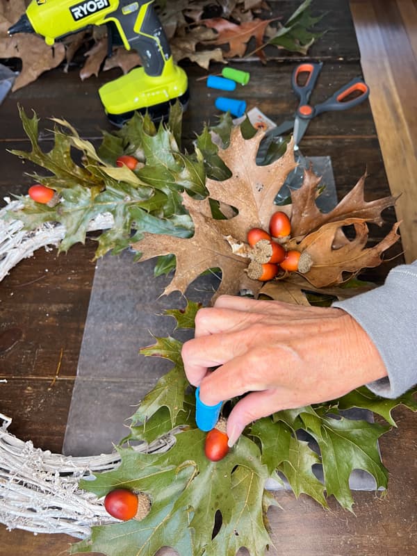 Add acorns randomly around the wreath