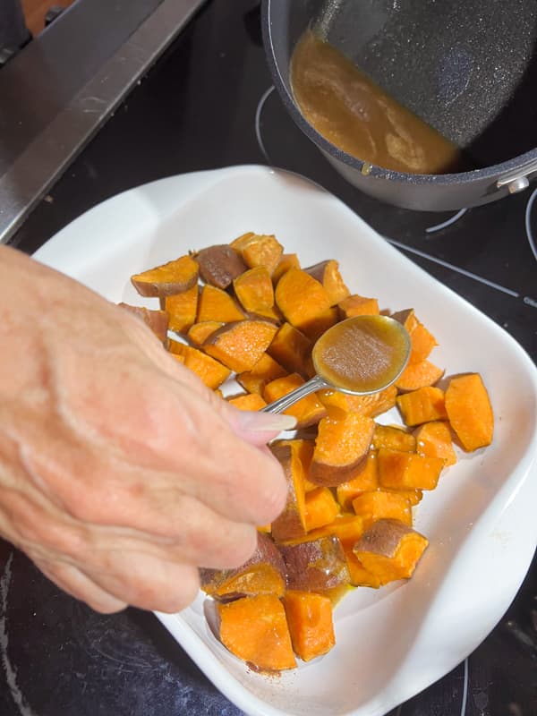 spoon caramel sauce of the sweet potato bake.  