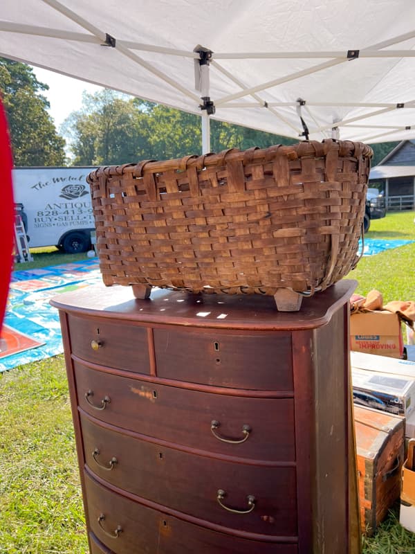 Vintage Basket and vintage dresser at antique festival. 
