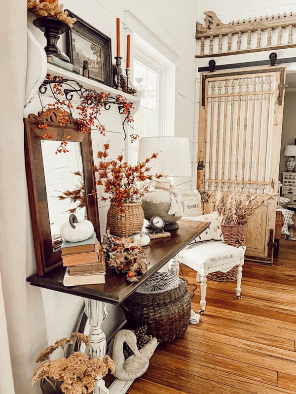 Industrial Farmhouse Style Entry Table with a Vintage Vignette and antiques in a modern farmhouse.