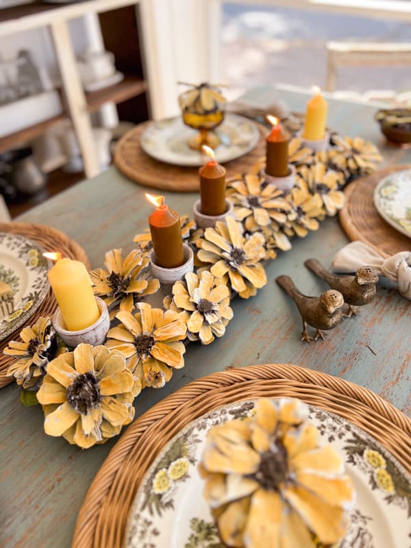 Reclaimed wood DIY Pinecone centerpiece with candles.