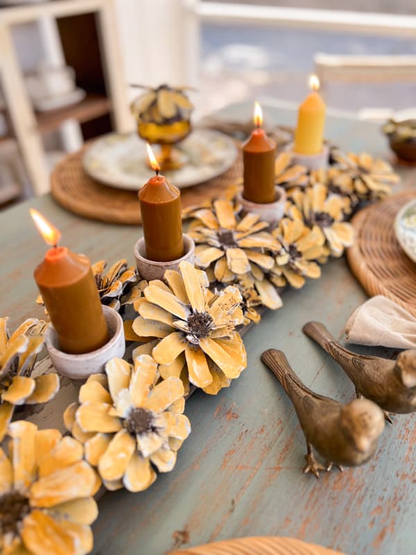 Pinecone flower art -DIY sunflower centerpiece with clay pot candleholders for stunning rustic centerpieces.  
