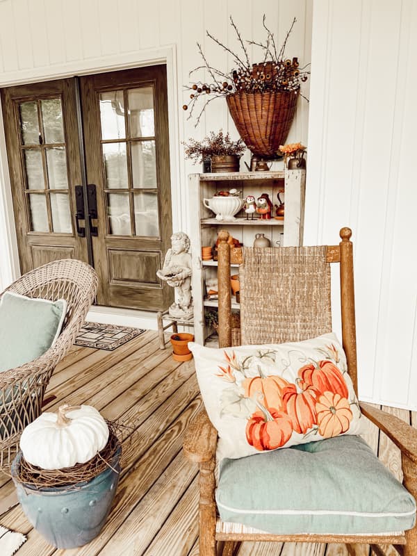 Seating ideas for fall farmhouse front porch ideas with rockers and pillows.