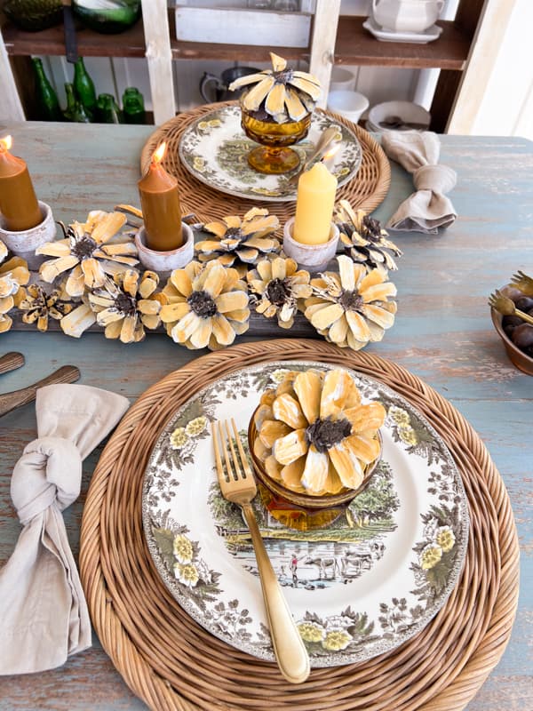 Sunflower Centerpiece made with pinecone flowers and reclaimed wood for rustic fall decorating. 