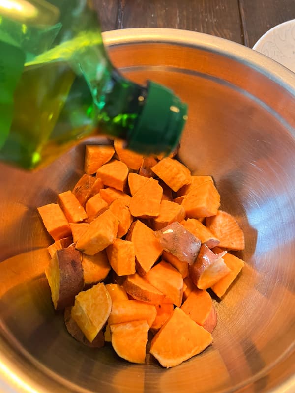 Toss Sweet Potatoes in olive oil to bake.