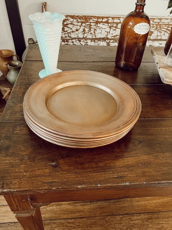 Vintage table with copper plater chargers.