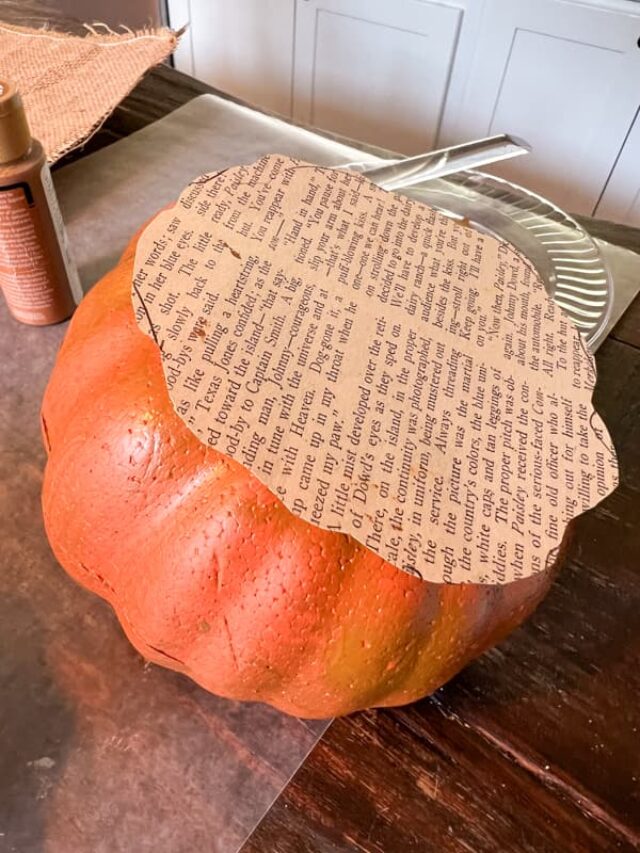 Faux Pumpkin covered with old book pages for fall decor. 