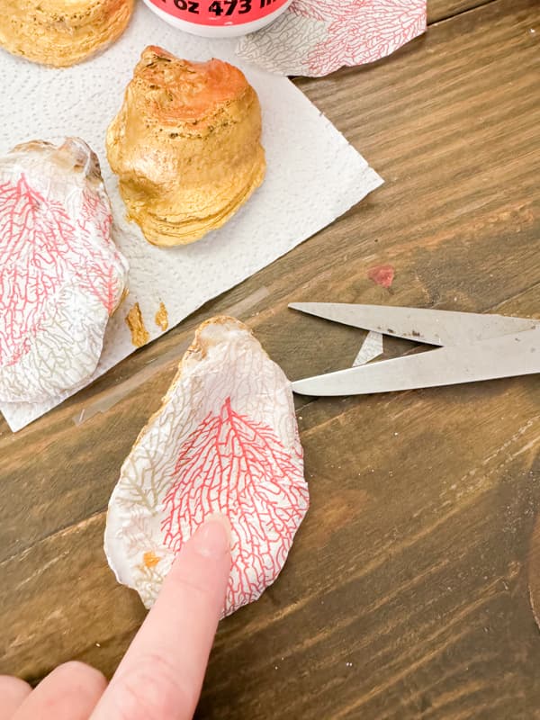 Press the napkin into the shell to decoupage it. Cottage core Beach Cottage holiday Decorating Ideas.  