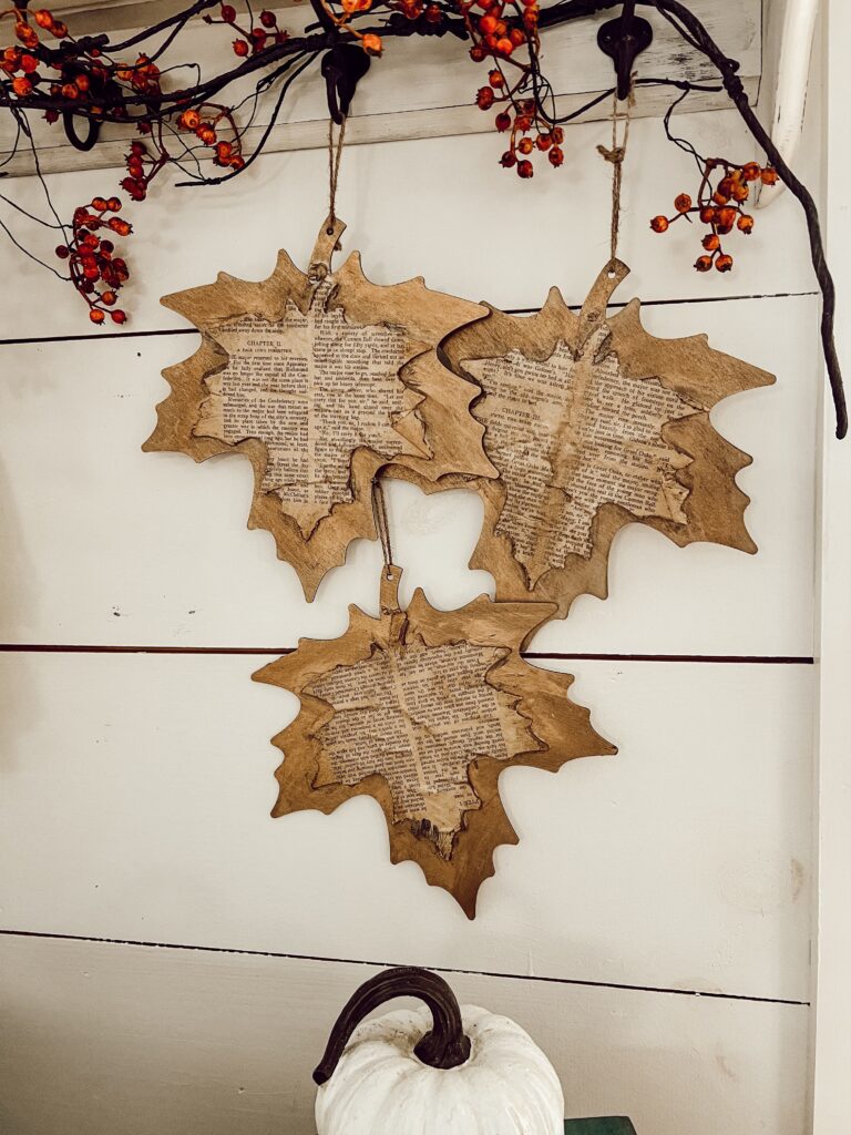 Hang from peg board DIY Old Book Leaf Craft with Dollar Tree Woodcraft for Fall Decorating.  Farmhouse Country Chic Style decor.