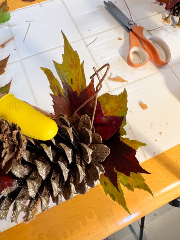 use maple leaves to make the pinecone turkey tail feathers.