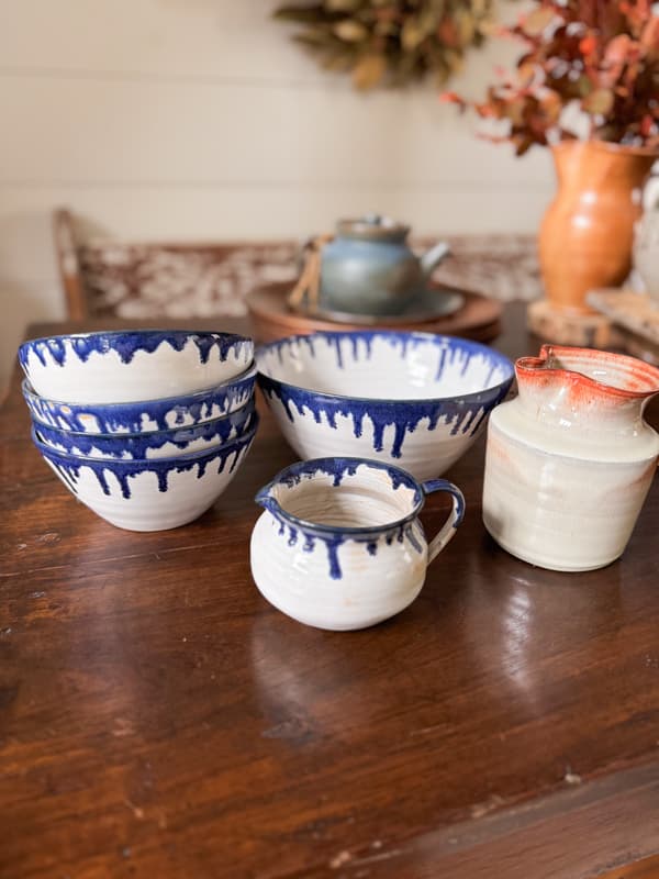 Coles Pottery pieces with a creamer signed by Nell Coles Graves at 84 years of age.