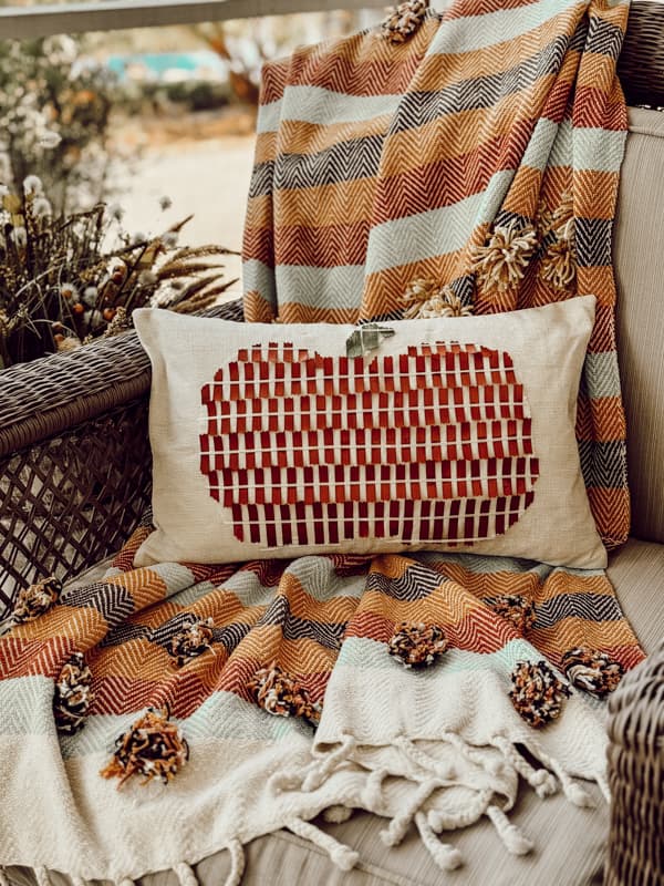 Ribbon Craft DIY Pumpkin Pillow Cover for Fall Farmhouse Decorating with rust ribbon.  