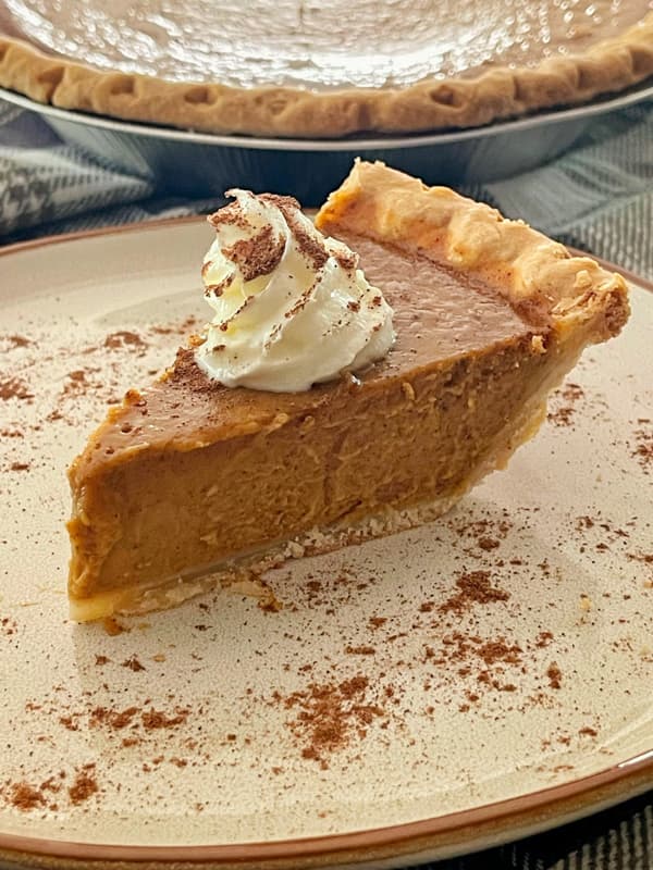 Pumpkin Pie recipe with flaky crust and whipped topping for a delicious Thanksgiving Pie Recipe.