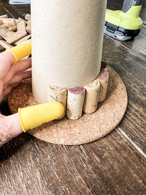 Add wine corks to bottom of cone to make a DIY Wine Cork Craft.